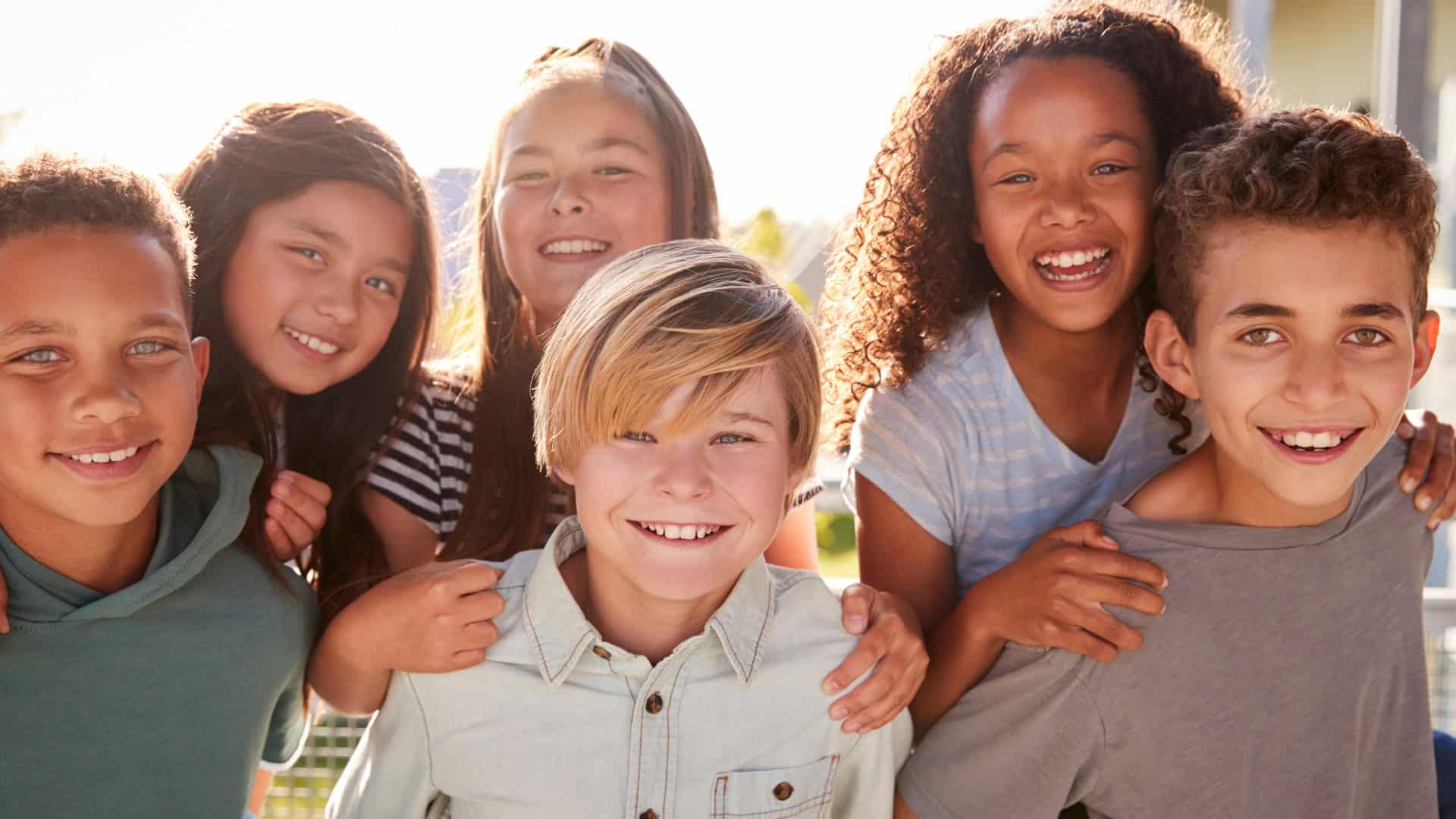 a group of smiling grade school friends