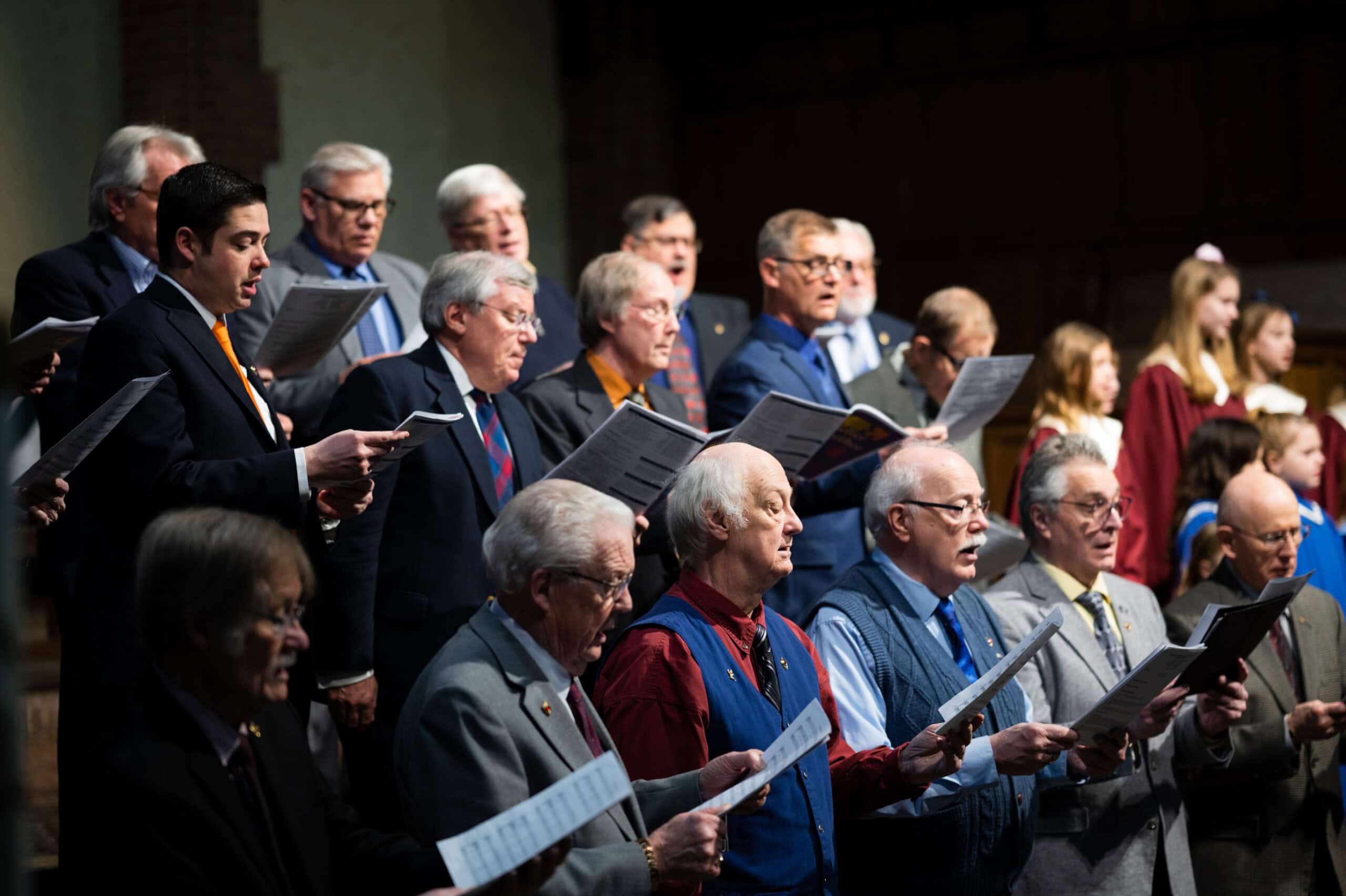 men singing in a formal choir